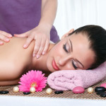 Woman in a day spa getting a deep tissue massage